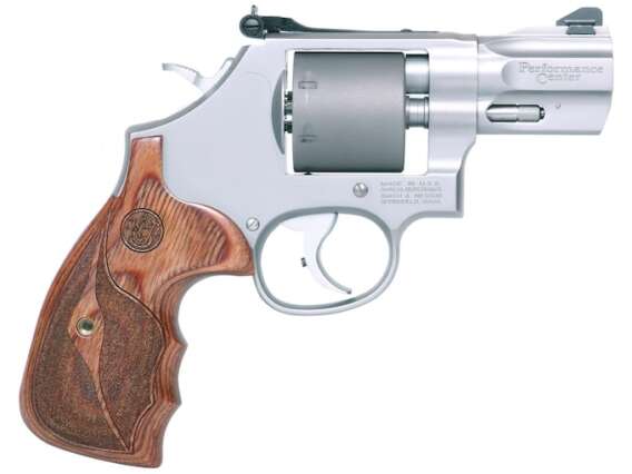 Smith & Wesson 986 Performance Center guns originate from standard designs or are created from the ground up. From hand-cutting and fitting to fine tuning for precision, these firearms are top performers. Products from the Performance Center are the ultimate expression of old-world craftsmanship blended with modern technology. Features Trigger Overtravel Stop Custom Barrel with Recessed Precision Crown Moon Clips Included Bossed Mainspring PC Tuned Action Unfluted Cylinder Smith & Wesson Made In United States of America warning-iconWARNING: Cancer and Reproductive Harm - www.P65Warnings.ca.gov. Specifications Product Information Cartridge 9mm Luger Action Type Revolver Capacity 7 Round Weight 31.4 Ounce Barrel Length 2.5 Inches Barrel Finish Stainless Threaded Muzzle No Compensated No Front Sight Blade and Ramp Rear Sight Adjustable Frame Material Stainless Steel Frame Finish Stainless Grip Material Laminate Wood Grip Style Finger Grooves Grip Color Wood Country of Origin United States of America Trigger Type Double/Single action